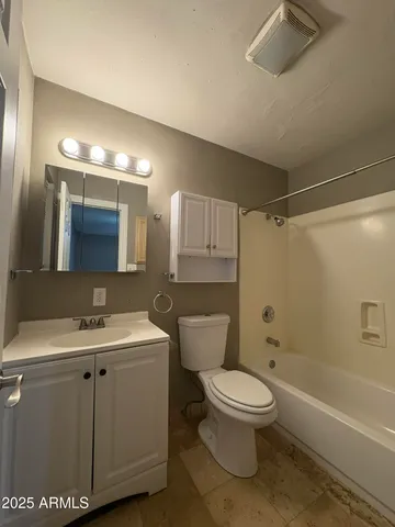 a bathroom with a toilet a sink and a bathtub