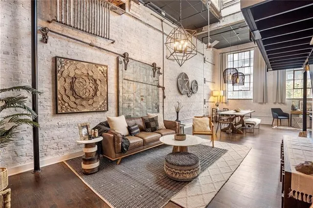 a living room with furniture and a rug
