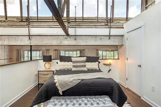 a bed sitting in a room next to a window