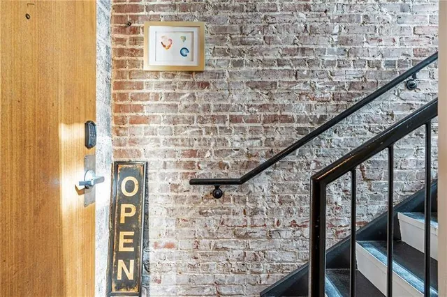a brick house with a large window