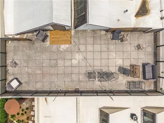 a view of a swimming pool with a patio