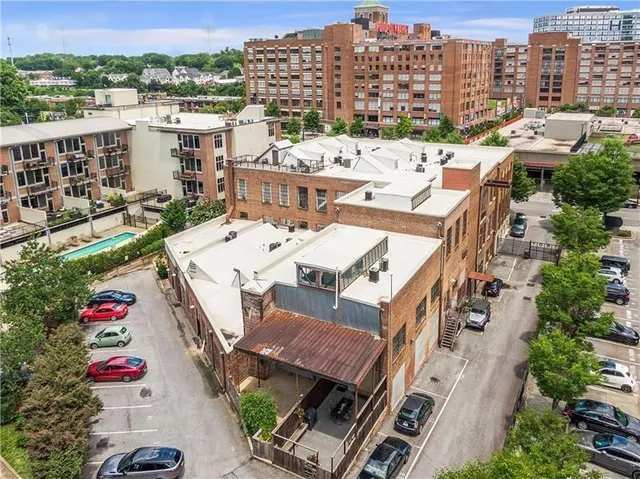 a front view of a building with garden
