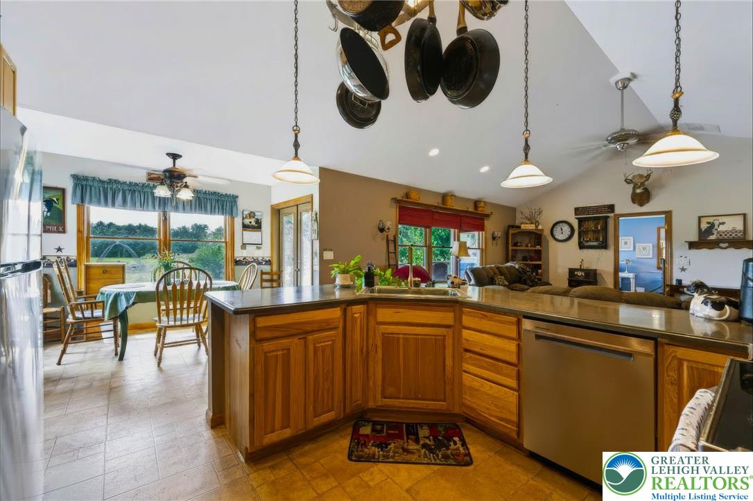 6970 Silver Crest Road Nazareth, PA 18064 - Photo 12 of 35 A well-equipped kitchen features a functional island with a sink and ample cabinet space, perfect for culinary endeavors.