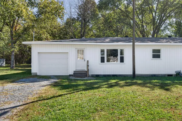 a view of a backyard of the house