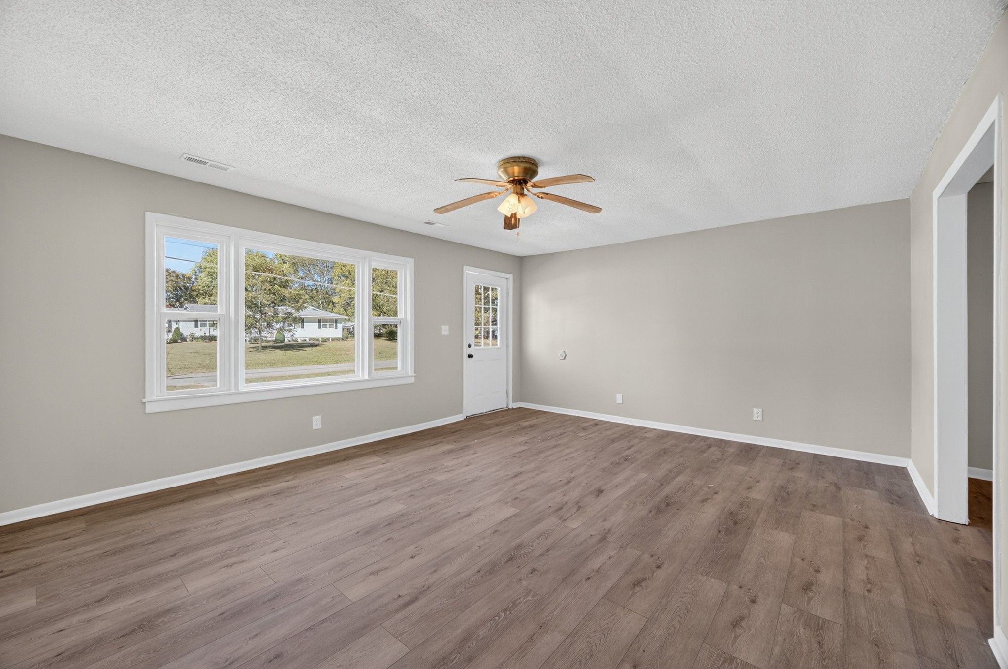 34 South Lincoln Road Fayetteville, TN 37334 - Photo 5 of 31 wooden floor in an empty room with a window