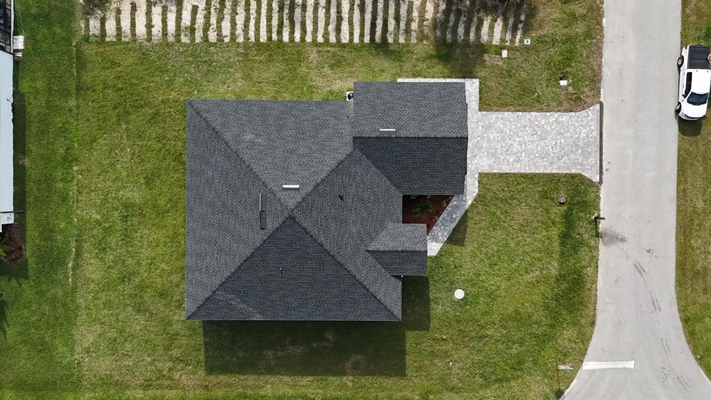10426 Live Oak Road Port Charlotte, FL 33981 - Photo 11 of 53 an aerial view of a house with a yard
