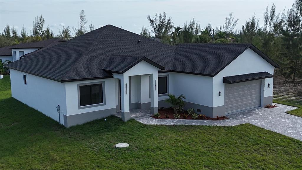 10426 Live Oak Road Port Charlotte, FL 33981 - Photo 14 of 53 a view of a house with backyard