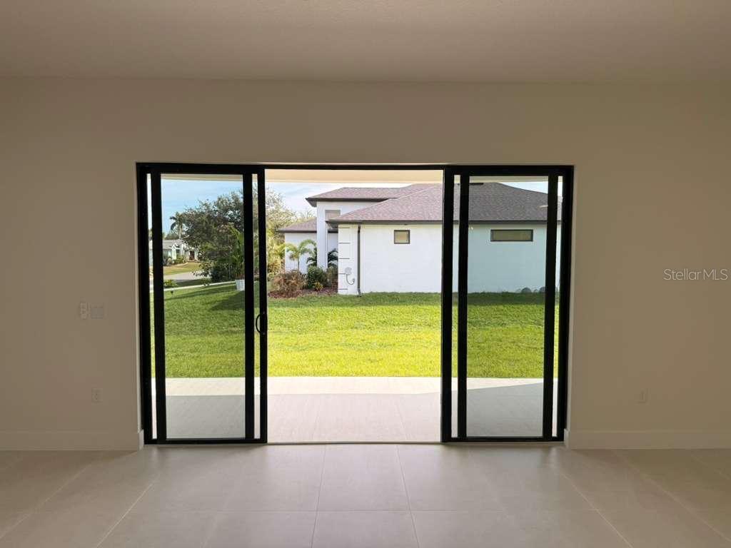 10426 Live Oak Road Port Charlotte, FL 33981 - Photo 29 of 53 a view of an empty room and window