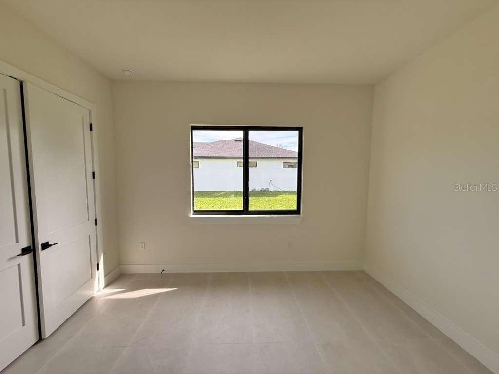 10426 Live Oak Road Port Charlotte, FL 33981 - Photo 43 of 53 an empty room with a window