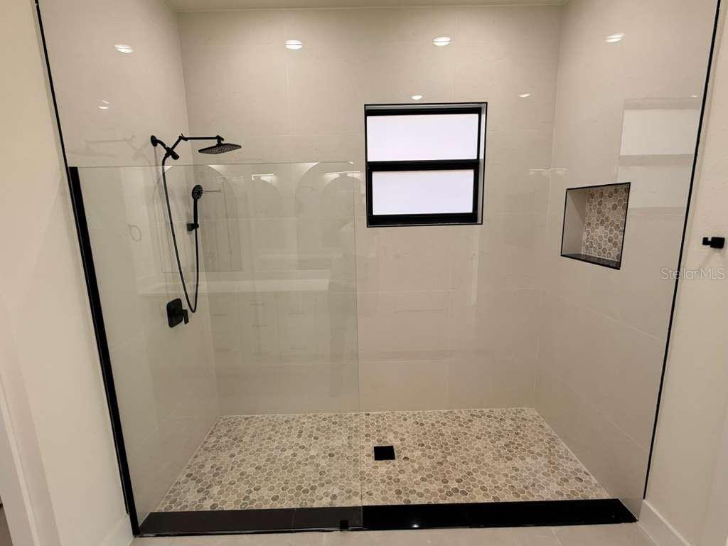 10426 Live Oak Road Port Charlotte, FL 33981 - Photo 49 of 53 a bathroom with a shower
