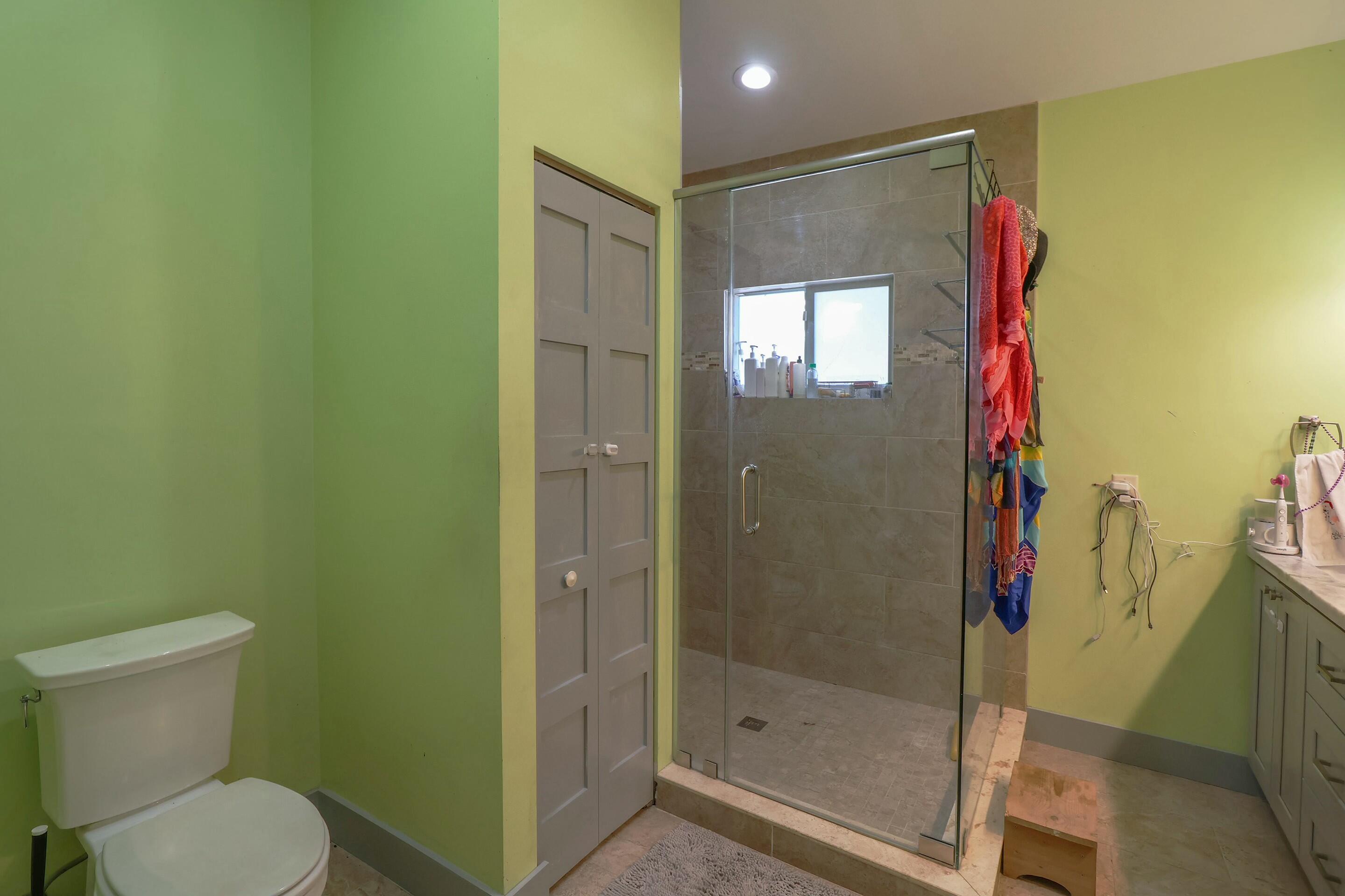 129 Lazy Lane Key Largo, FL 33037 - Photo 13 of 35 a bathroom with a shower and a toilet