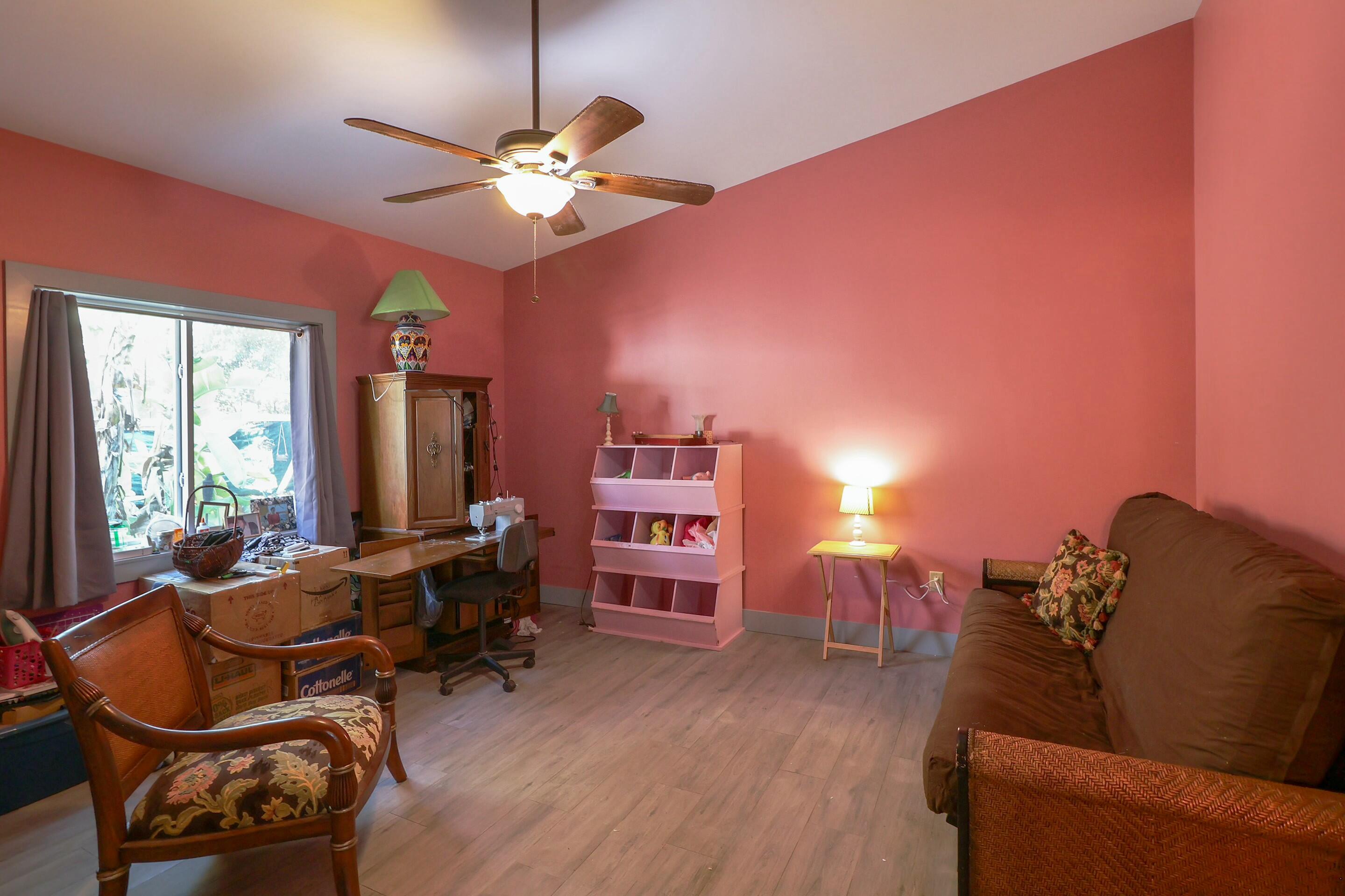 129 Lazy Lane Key Largo, FL 33037 - Photo 15 of 35 a living room with furniture and a chandelier