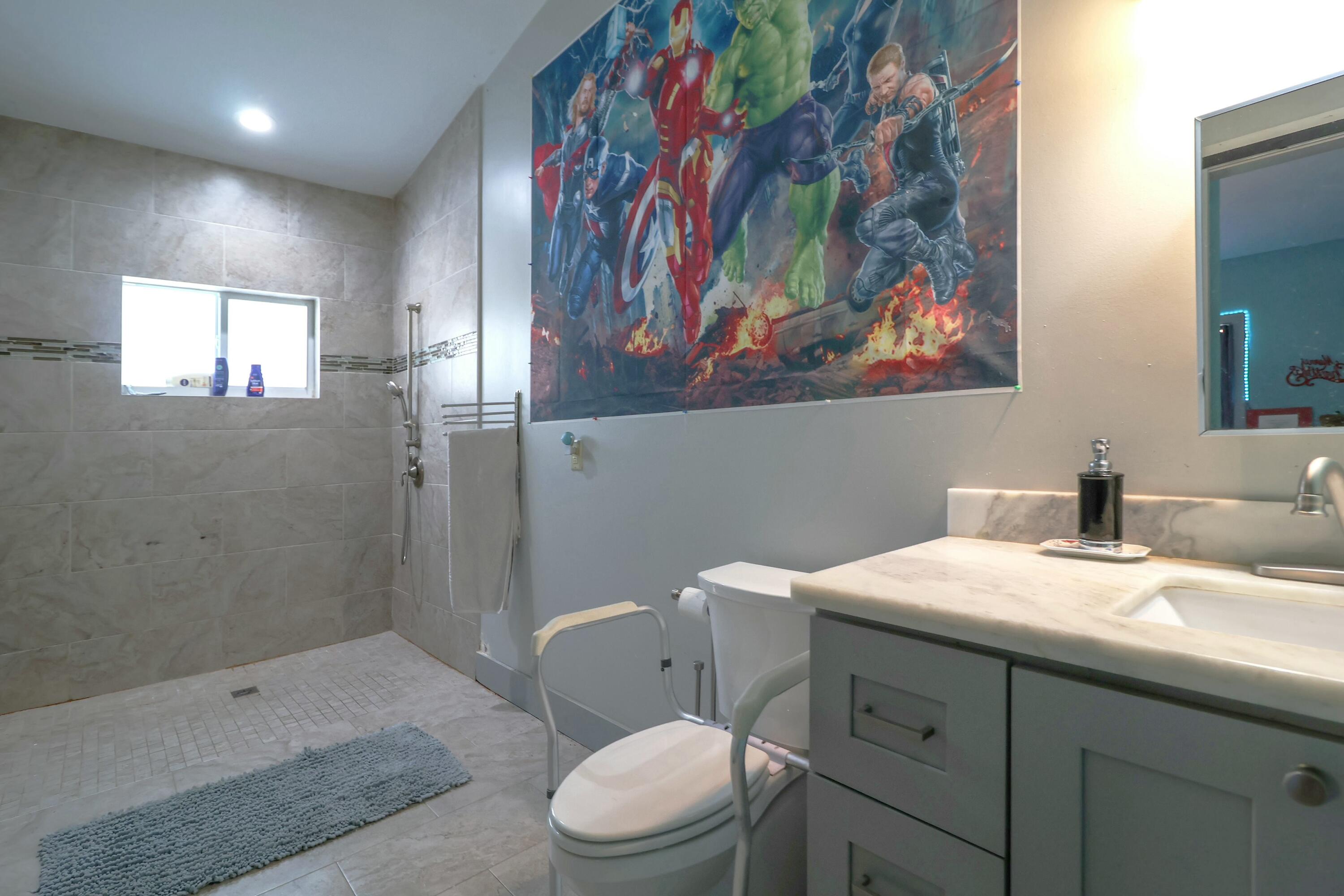 129 Lazy Lane Key Largo, FL 33037 - Photo 19 of 35 a bathroom with a sink a toilet and shower