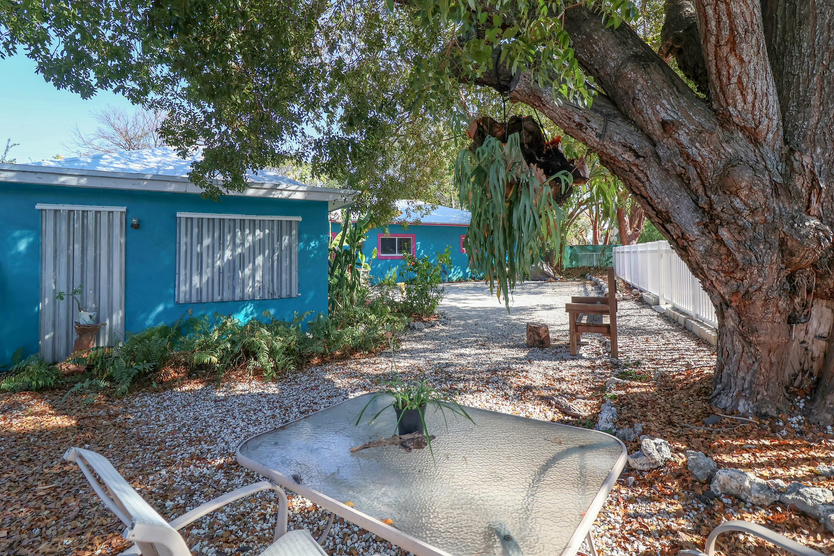 129 Lazy Lane Key Largo, FL 33037 - Photo 22 of 35 a view of a house with backyard and sitting area