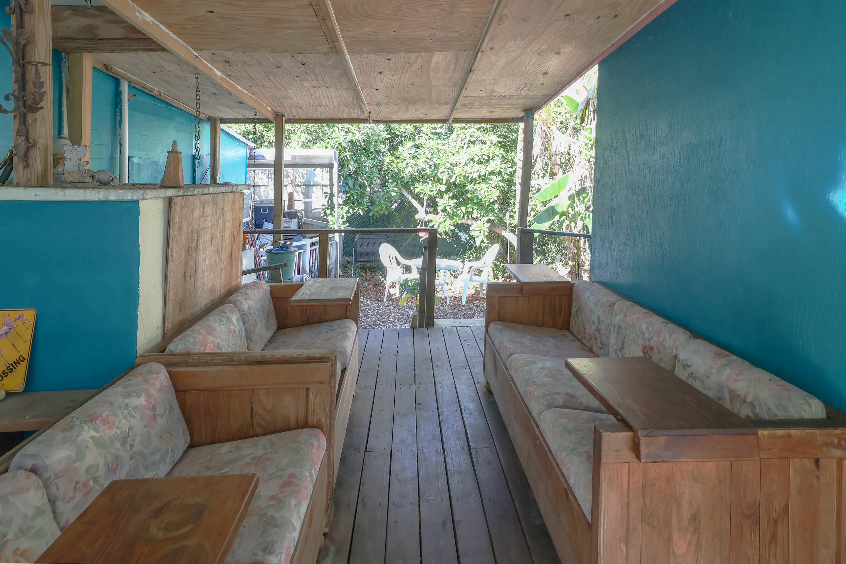 129 Lazy Lane Key Largo, FL 33037 - Photo 29 of 35 a living room with furniture and a large window