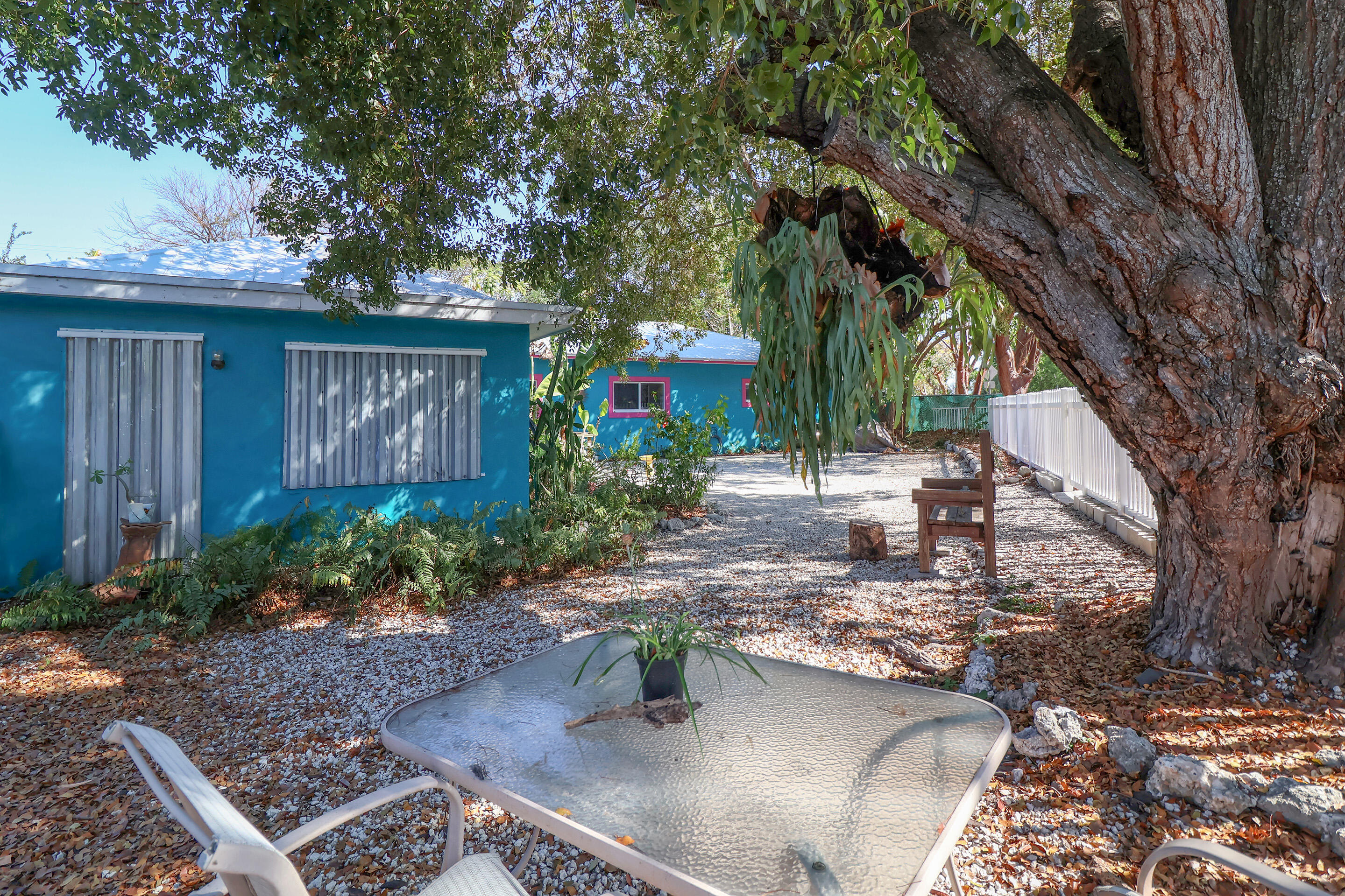 129 Lazy Lane Key Largo, FL 33037 - Photo 34 of 35 a view of a house with a yard siting area and garden