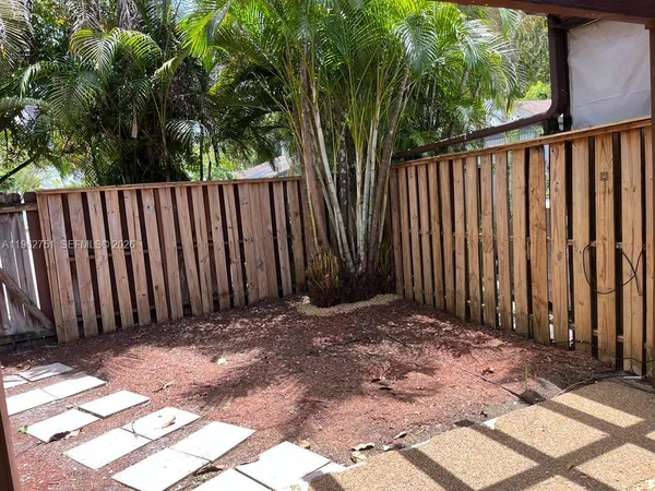 a view of a wooden fence