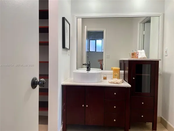 a bathroom with a double vanity sink and mirror