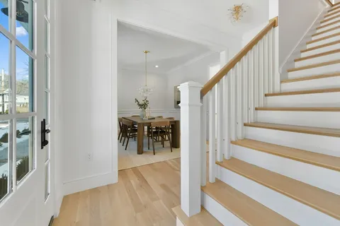 a view of entryway and hall with dining room