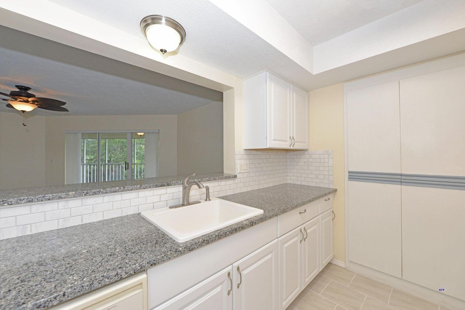 3254 Southeast Aster Lane, Unit 239 Stuart, FL 34994 - Photo 12 of 24 a bathroom with a sink and a mirror