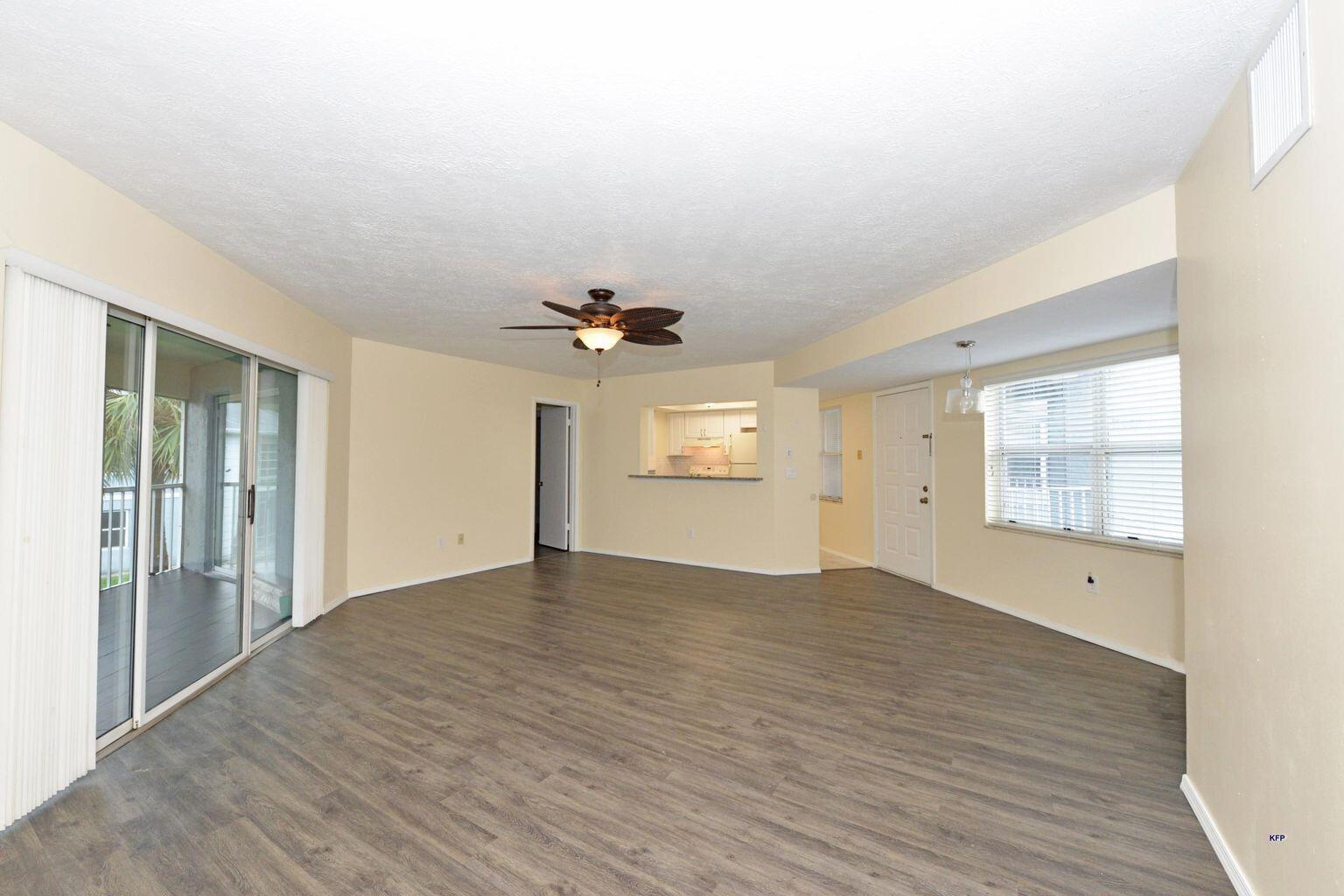 3254 Southeast Aster Lane, Unit 239 Stuart, FL 34994 - Photo 15 of 24 wooden floor in an empty room with a window