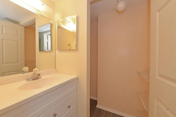 a white toilet sitting next to a shower
