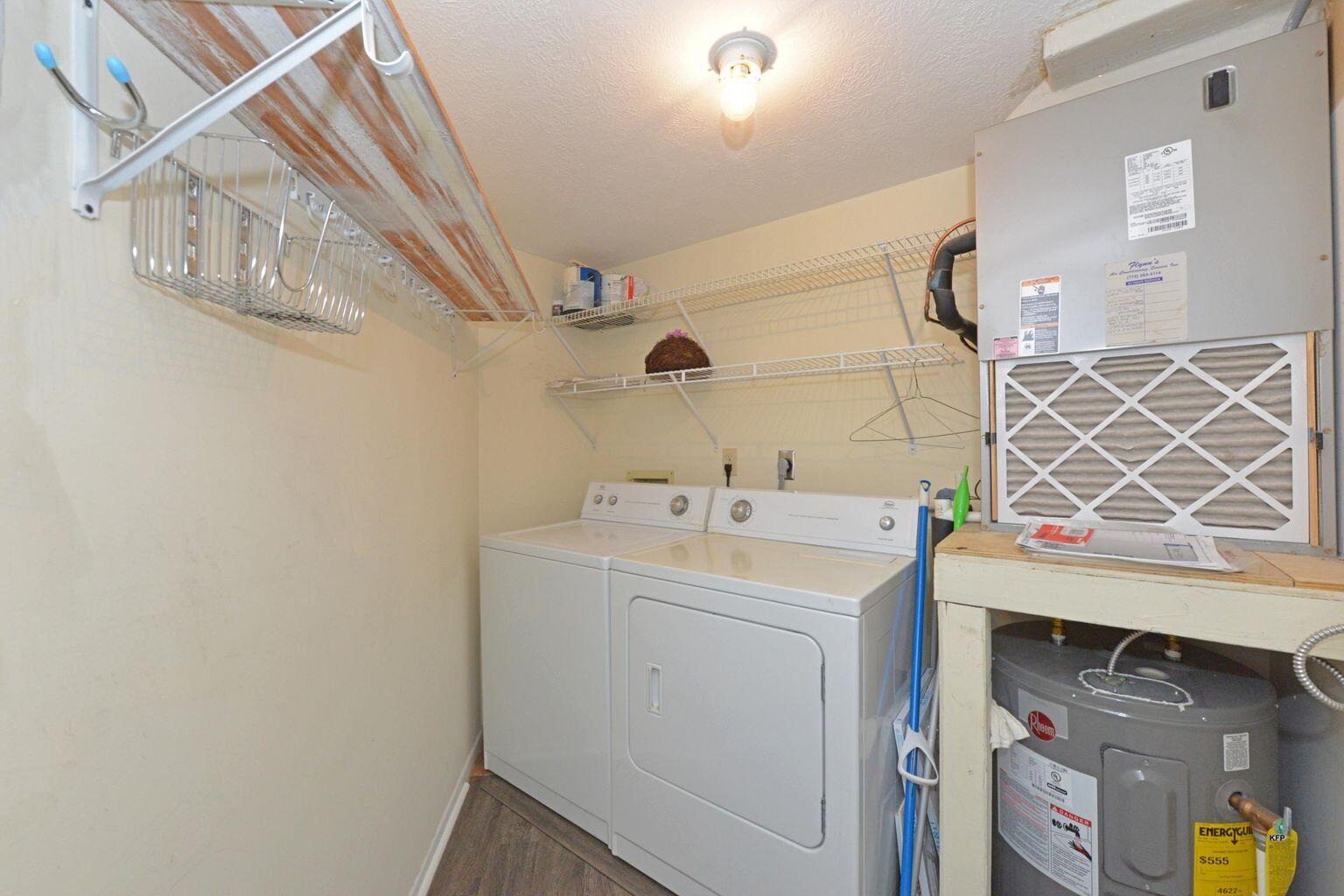 3254 Southeast Aster Lane, Unit 239 Stuart, FL 34994 - Photo 20 of 24 a utility room with dryer and washer