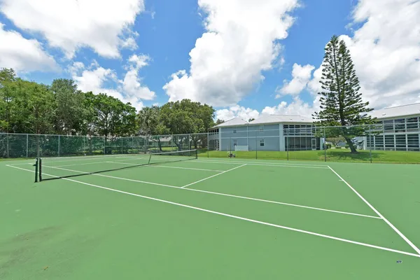 a view of a porch with furniture and garden