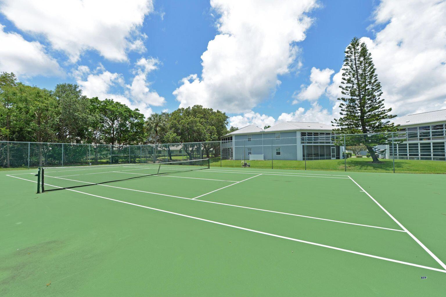 3254 Southeast Aster Lane, Unit 239 Stuart, FL 34994 - Photo 4 of 24 a view of a tennis court