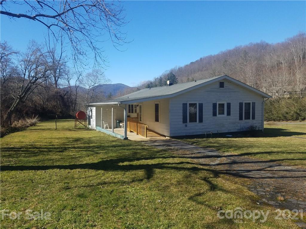 1118 Camp Branch Road Waynesville, NC 28786 - Photo 1 of 30 a front view of a house with a garden