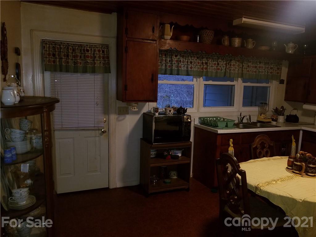 1118 Camp Branch Road Waynesville, NC 28786 - Photo 15 of 30 a kitchen with a refrigerator and a stove