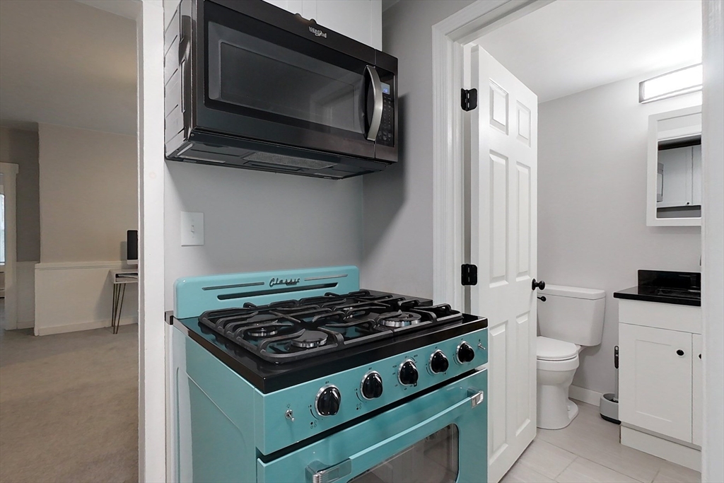 6 Kendall Street Methuen, MA 01844 - Photo 14 of 42 a kitchen with a stove and a microwave