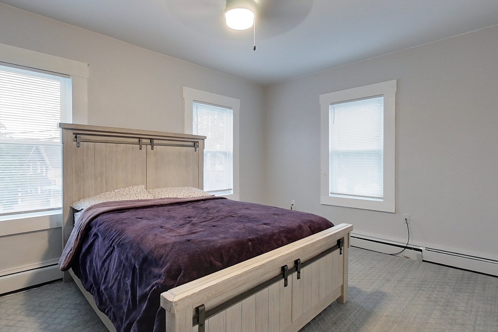 6 Kendall Street Methuen, MA 01844 - Photo 18 of 42 a bedroom with a bed and window