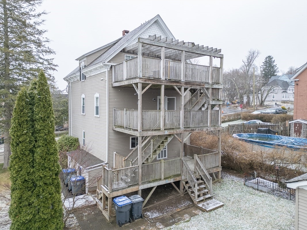 6 Kendall Street Methuen, MA 01844 - Photo 2 of 42 a view of a chair and table in the backyard