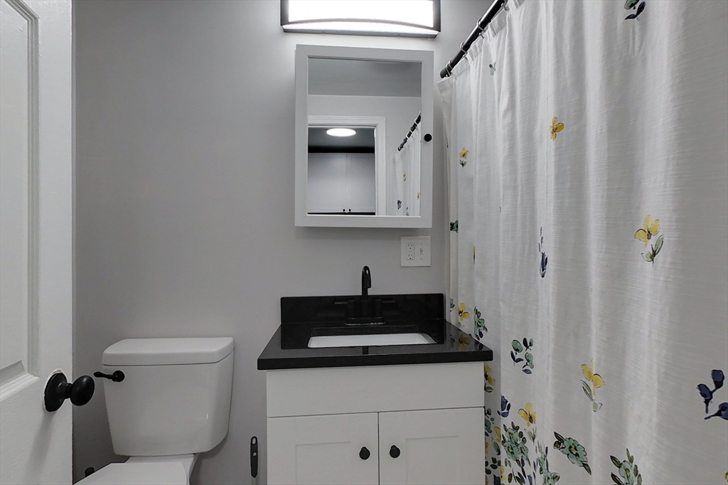 6 Kendall Street Methuen, MA 01844 - Photo 22 of 42 a bathroom with a sink and a toilet