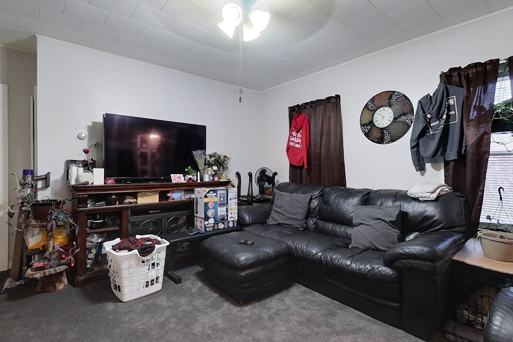 6 Kendall Street Methuen, MA 01844 - Photo 27 of 42 a living room with furniture and a flat screen tv