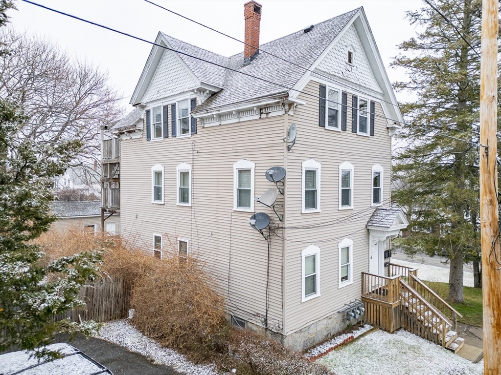 6 Kendall Street Methuen, MA 01844 - Photo 37 of 42 a view of a white house next to a yard