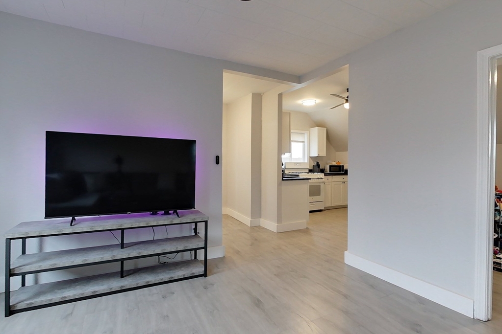 6 Kendall Street Methuen, MA 01844 - Photo 5 of 42 a living room with furniture and a flat screen tv