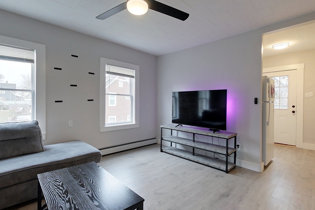 6 Kendall Street Methuen, MA 01844 - Photo 6 of 42 a living room with furniture and a flat screen tv