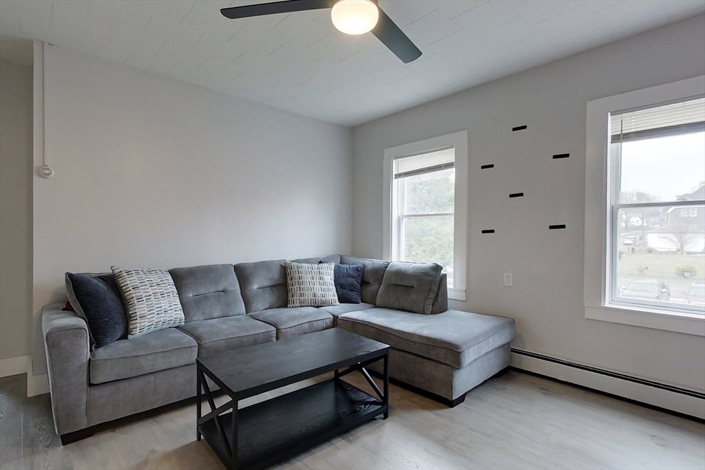6 Kendall Street Methuen, MA 01844 - Photo 7 of 42 a living room with furniture and a window