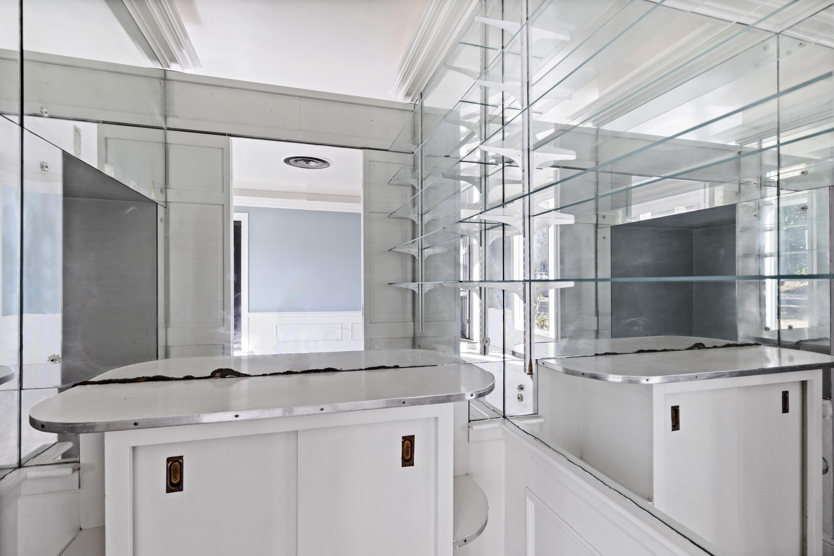 693 Holly Street Memphis, TN 38112 - Photo 11 of 32 a kitchen with a sink a refrigerator and cabinets