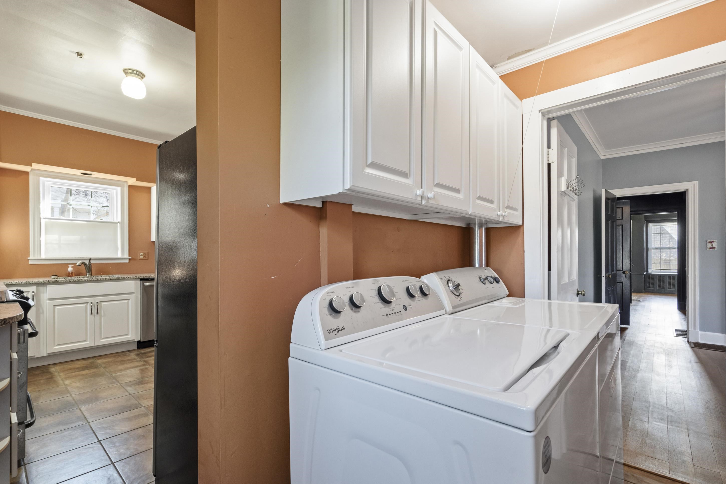 693 Holly Street Memphis, TN 38112 - Photo 13 of 32 a utility room with dryer and washer