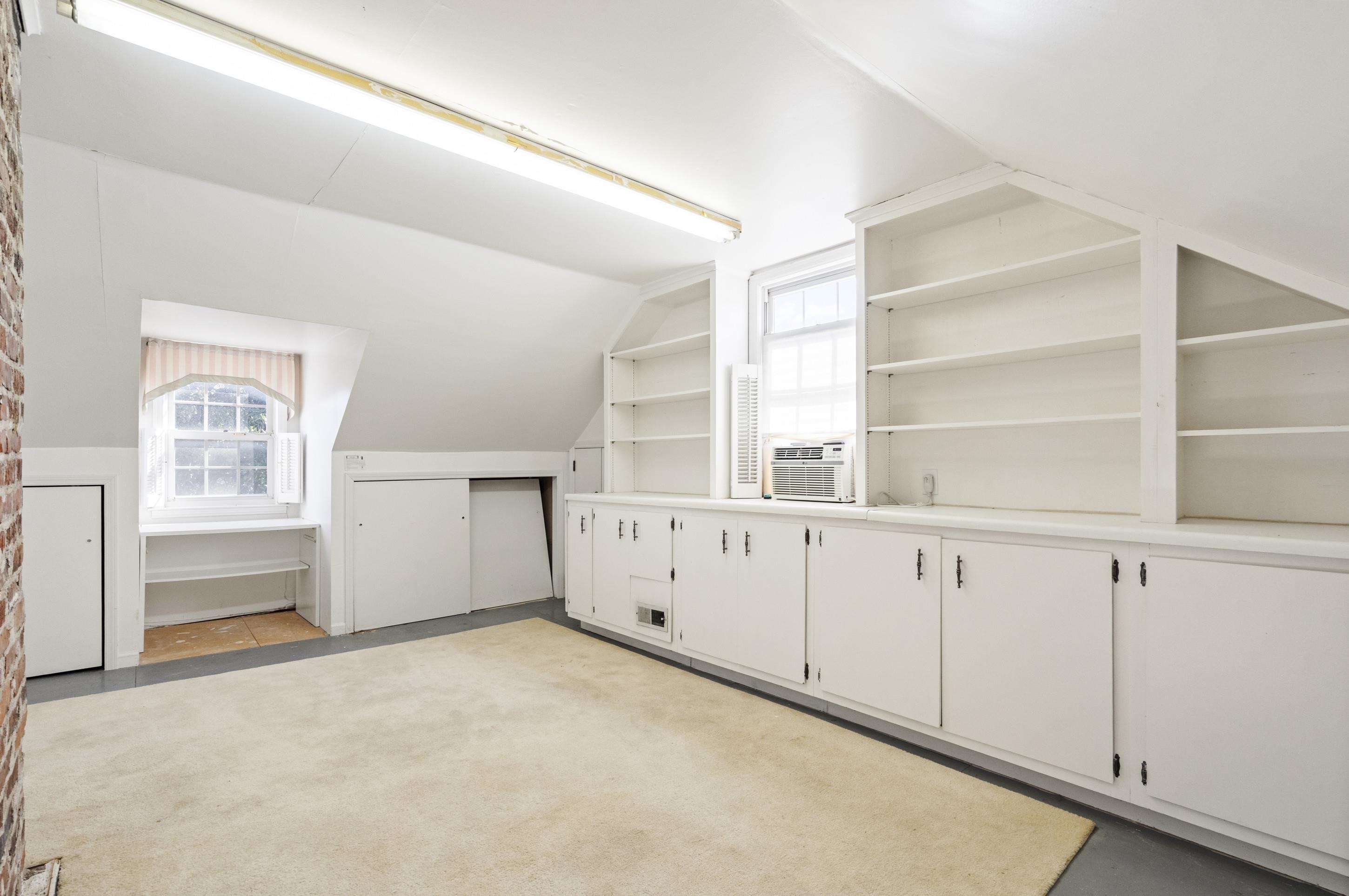 693 Holly Street Memphis, TN 38112 - Photo 17 of 32 a view of an empty room with a window