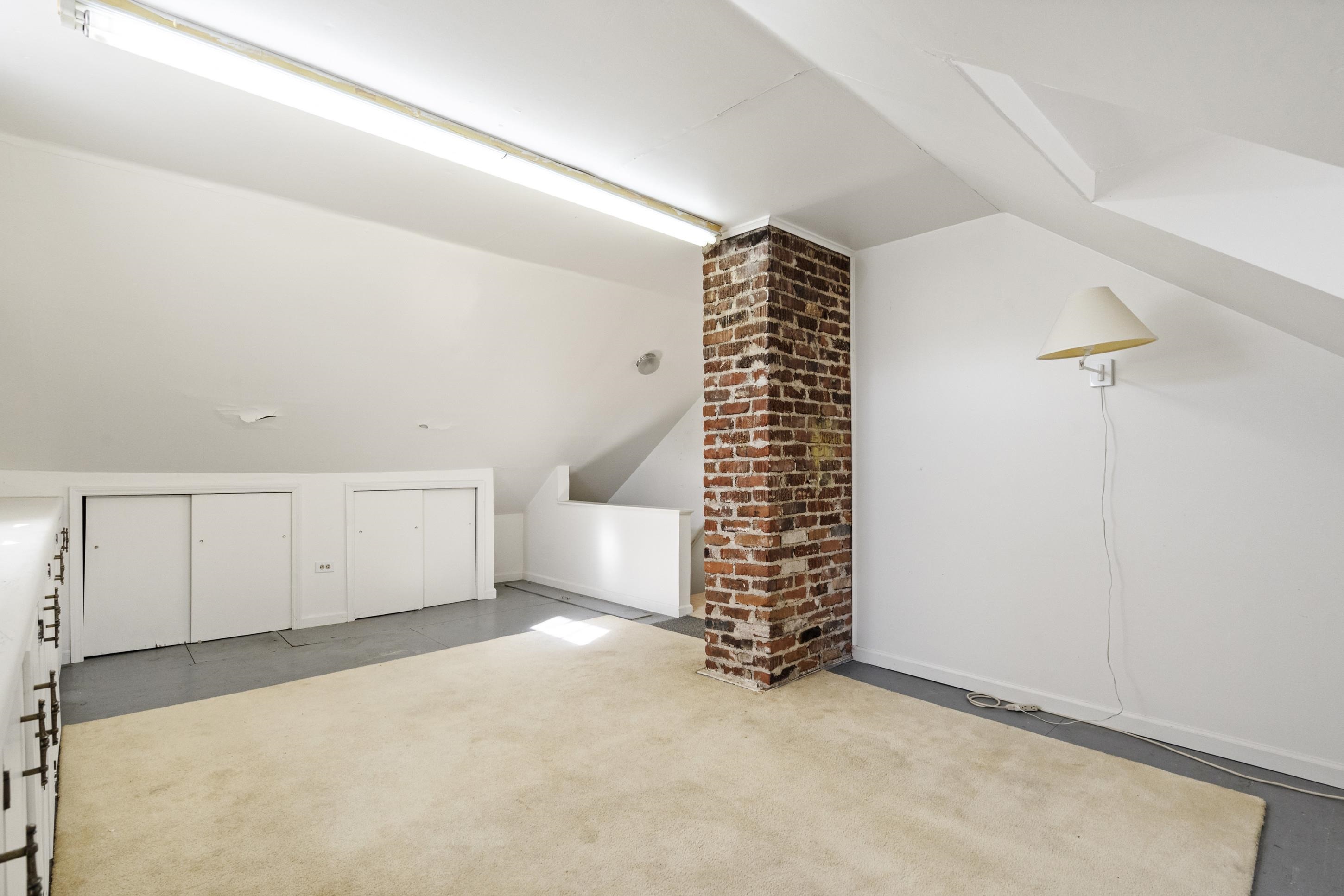 693 Holly Street Memphis, TN 38112 - Photo 18 of 32 an empty room with windows