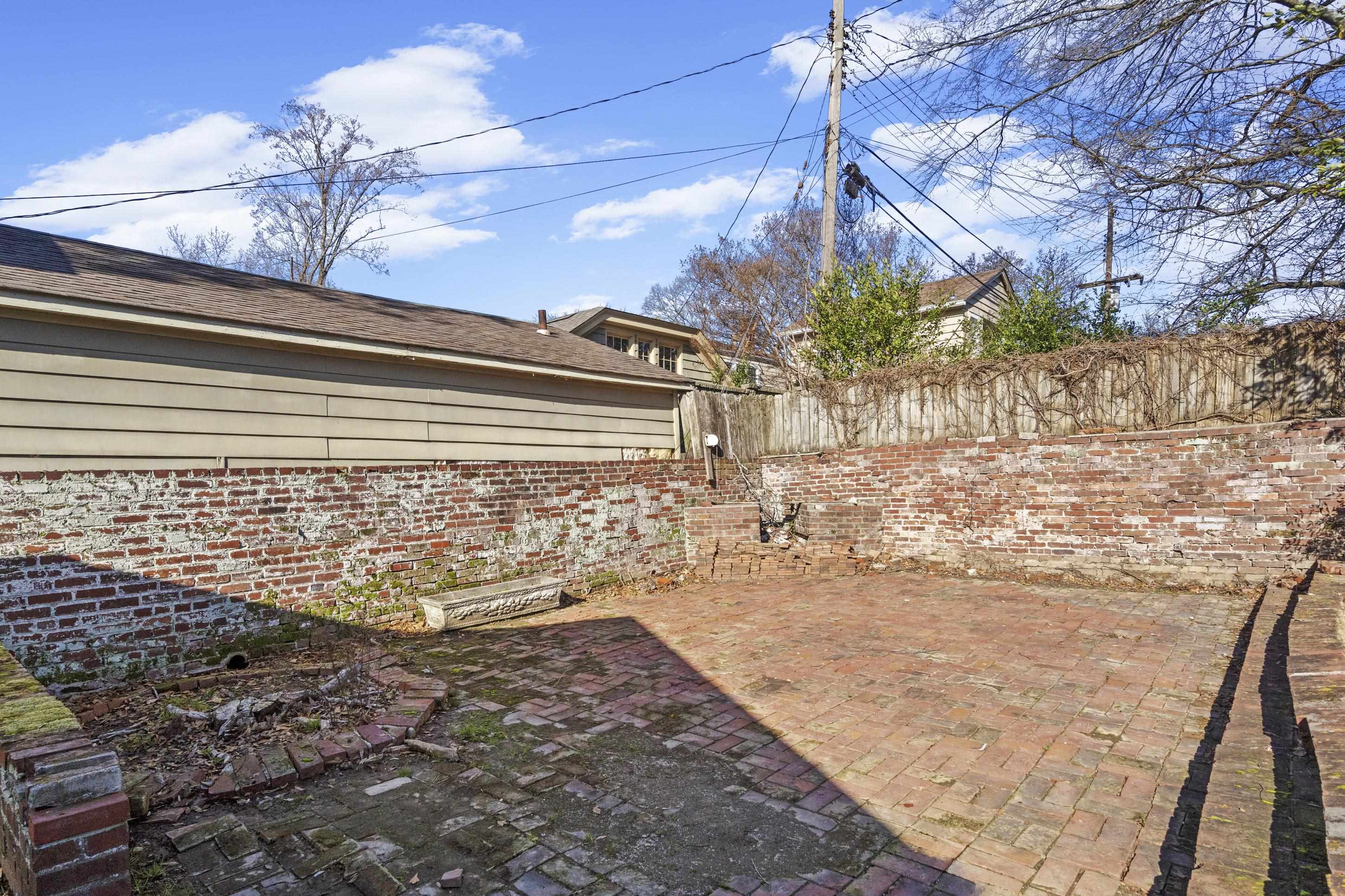 693 Holly Street Memphis, TN 38112 - Photo 23 of 32 a view of a backyard of the house