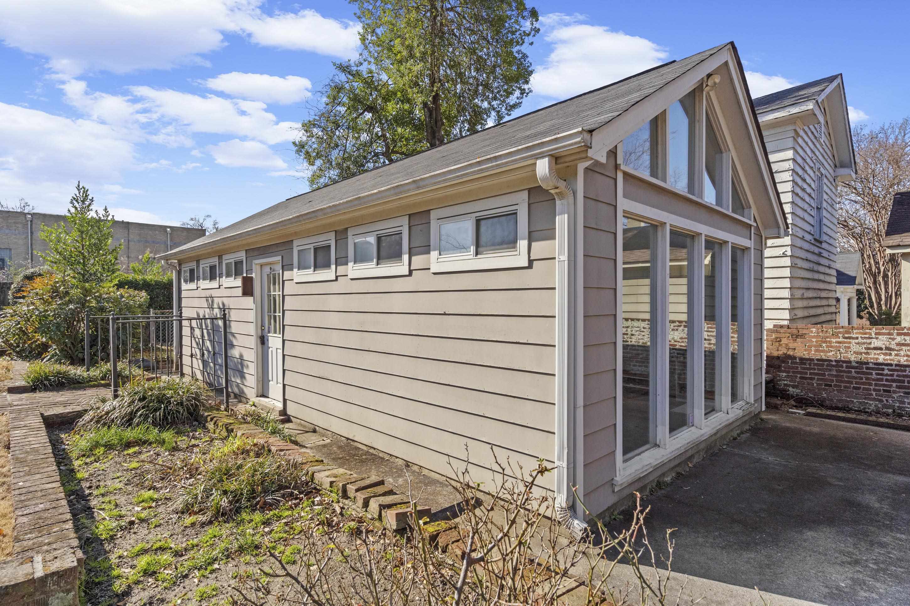 693 Holly Street Memphis, TN 38112 - Photo 24 of 32 a front view of a house with garden