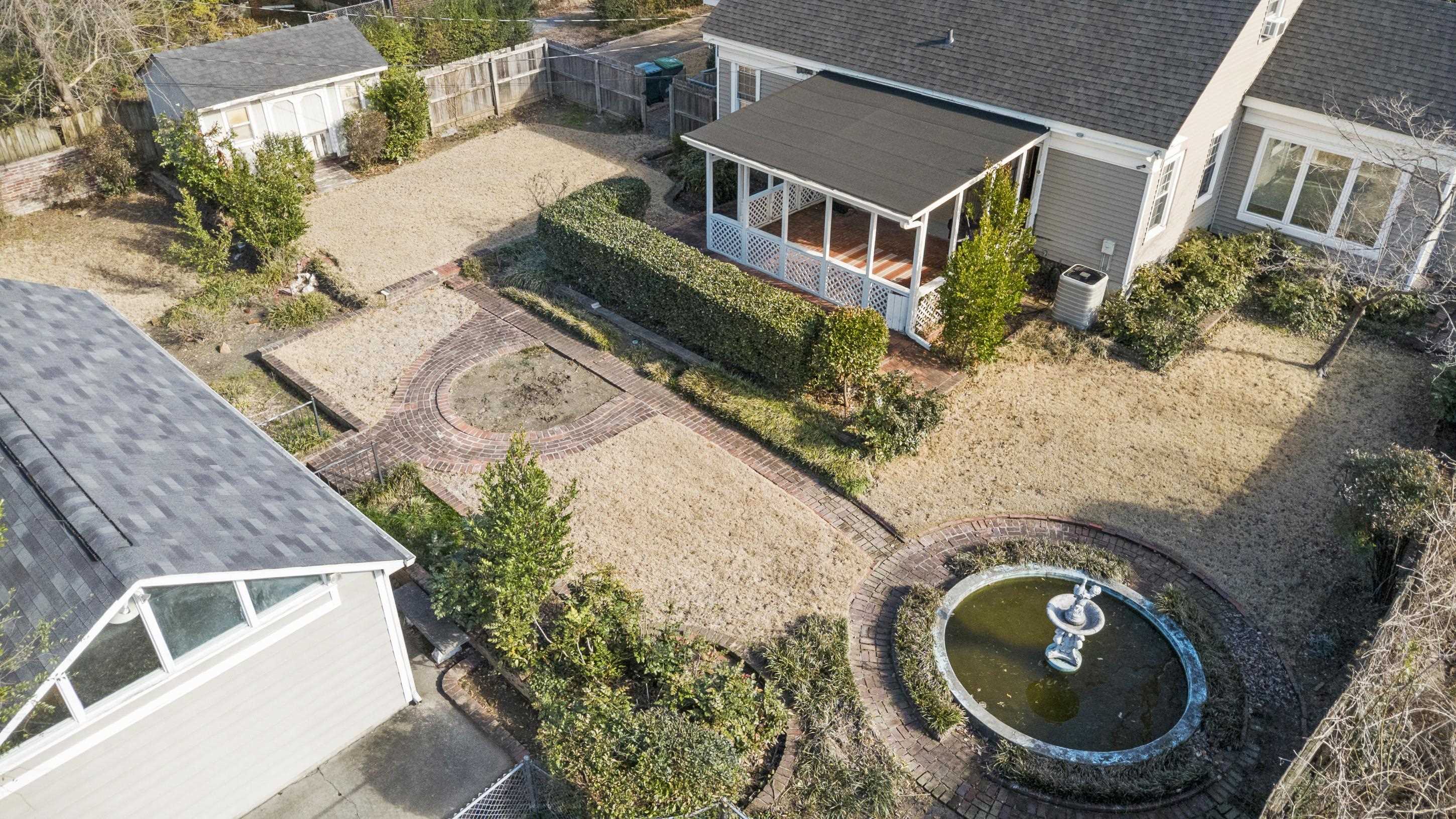 693 Holly Street Memphis, TN 38112 - Photo 28 of 32 an aerial view of a house with a yard
