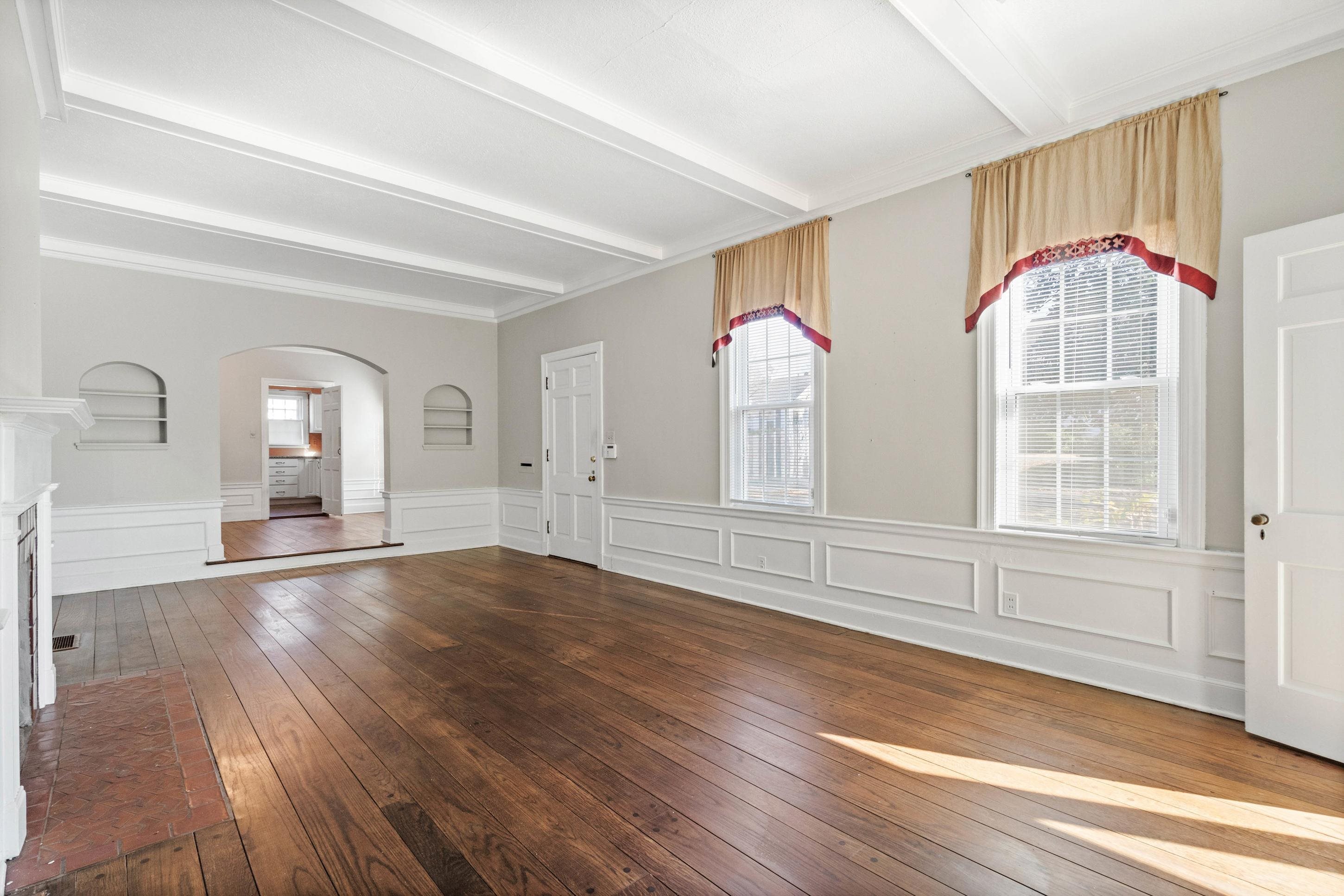 693 Holly Street Memphis, TN 38112 - Photo 6 of 32 a view of empty room with wooden floor and fan