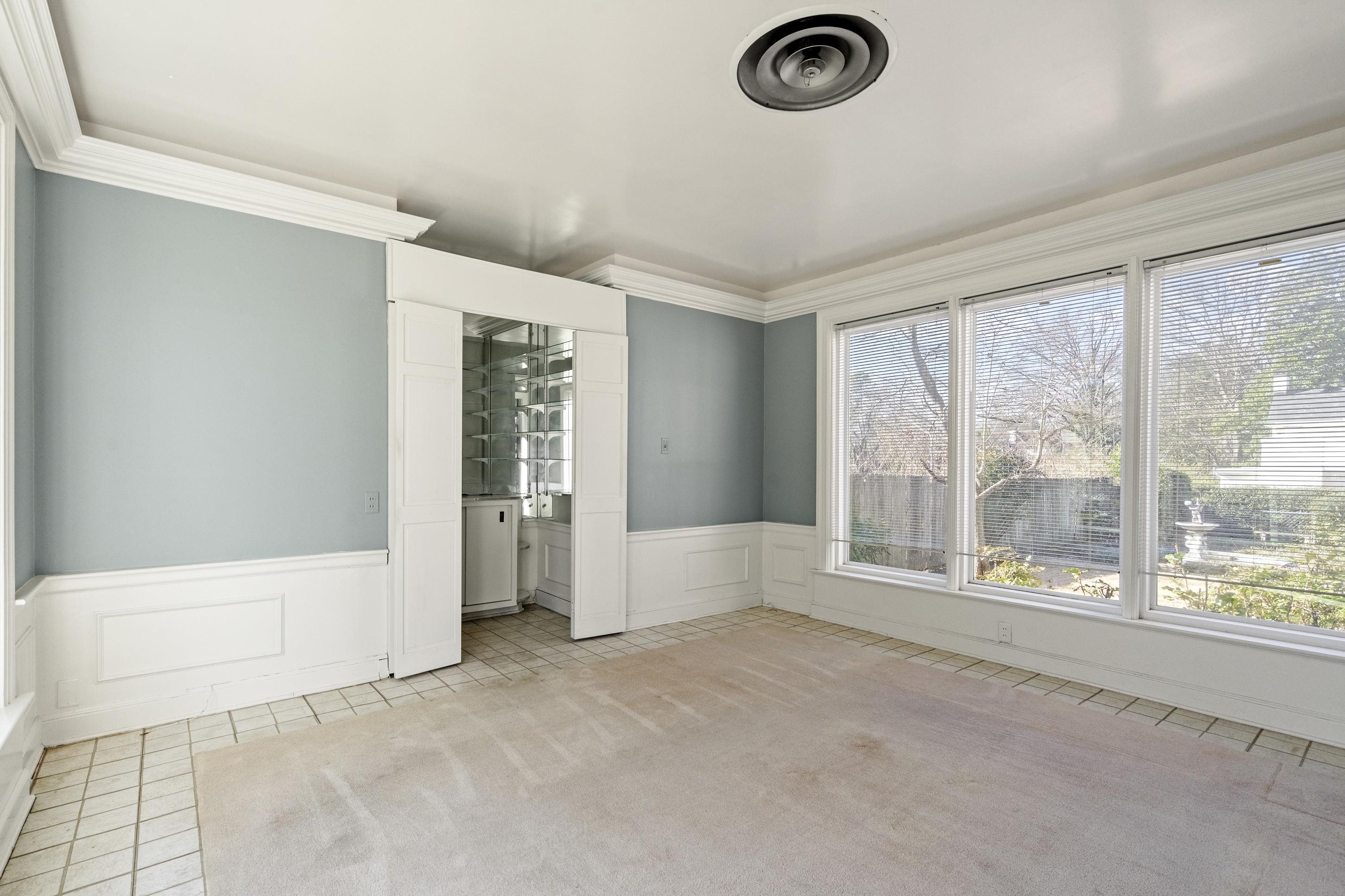 693 Holly Street Memphis, TN 38112 - Photo 10 of 32 a view of room with window and a ceiling fan