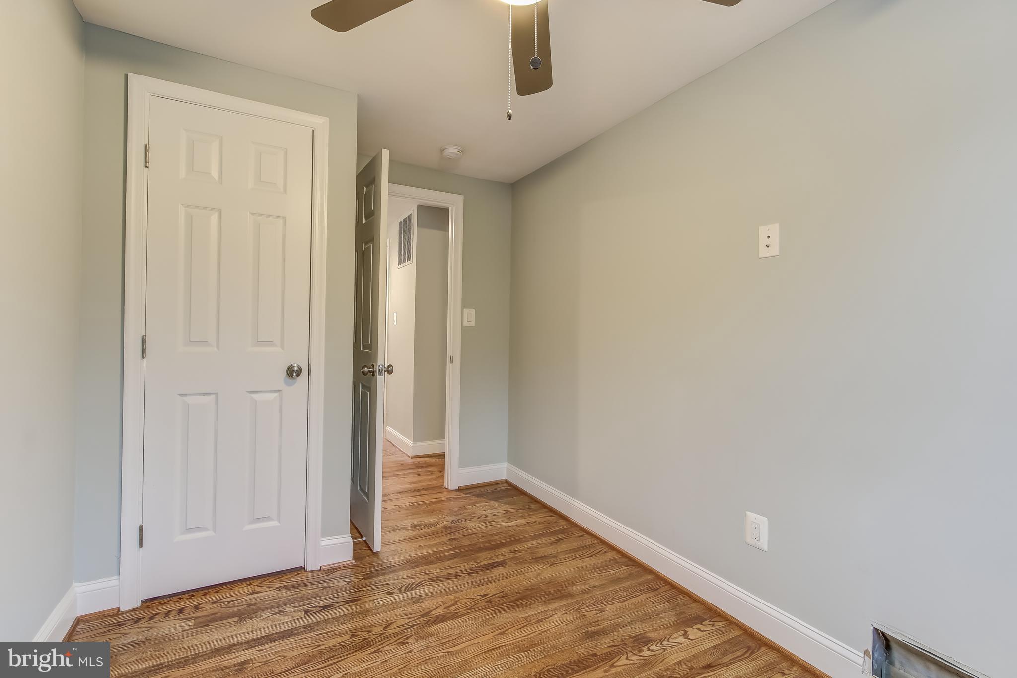 8202 Sheriff Road Landover, MD 20785 - Photo 22 of 24 a view of an empty room with wooden floor